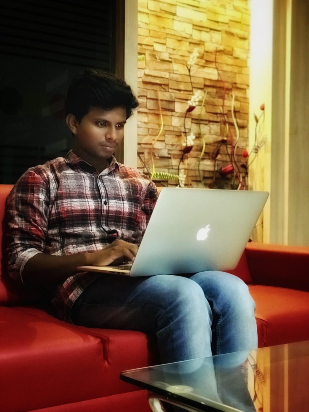 A men sitting with laptop
